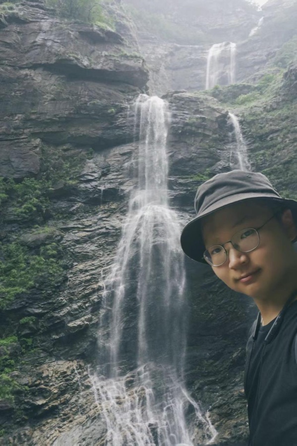 Yangyang Yu by a waterfall